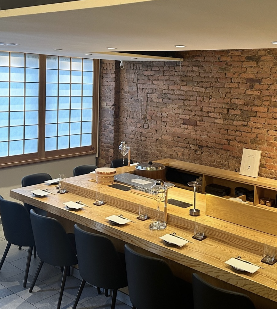 The light-wood omakase counter at Mido Omakase Room West Village, set for service