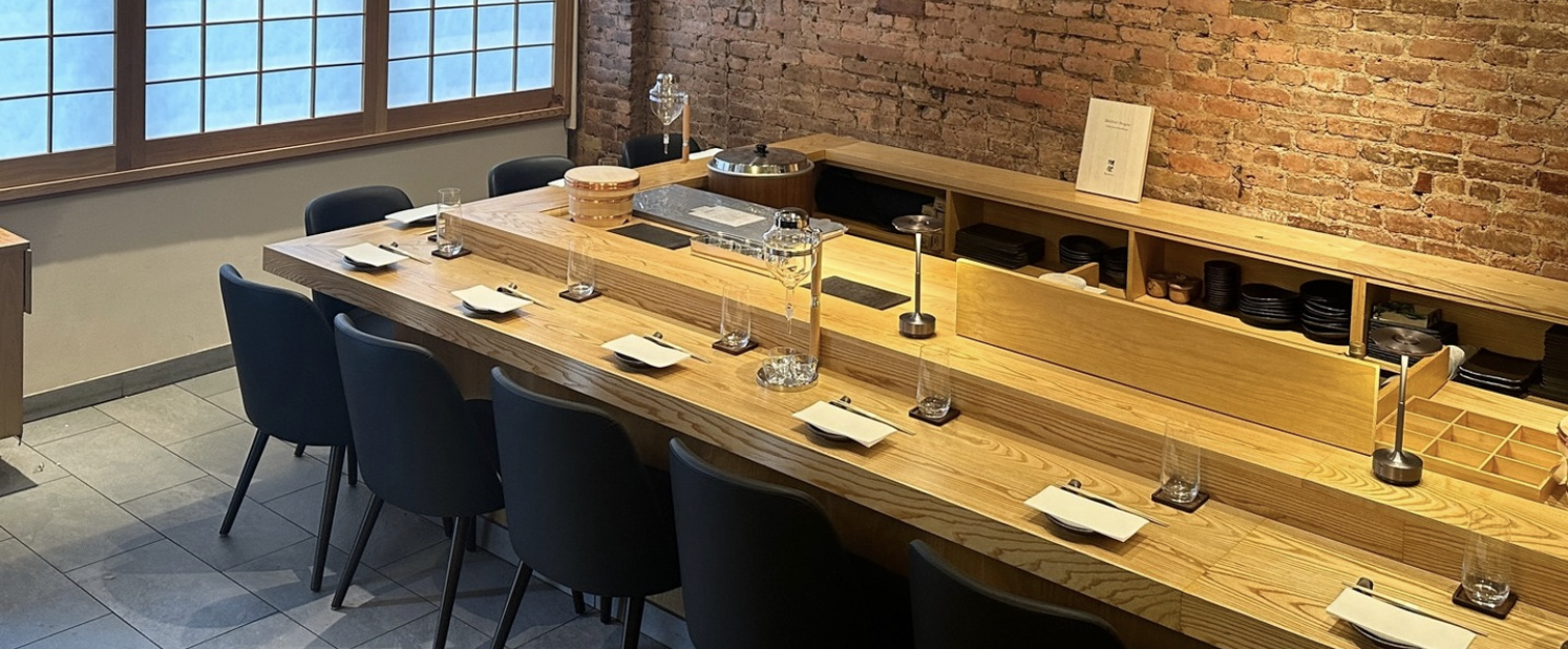 The light-wood omakase counter at Mido Omakase Room West Village, set for service